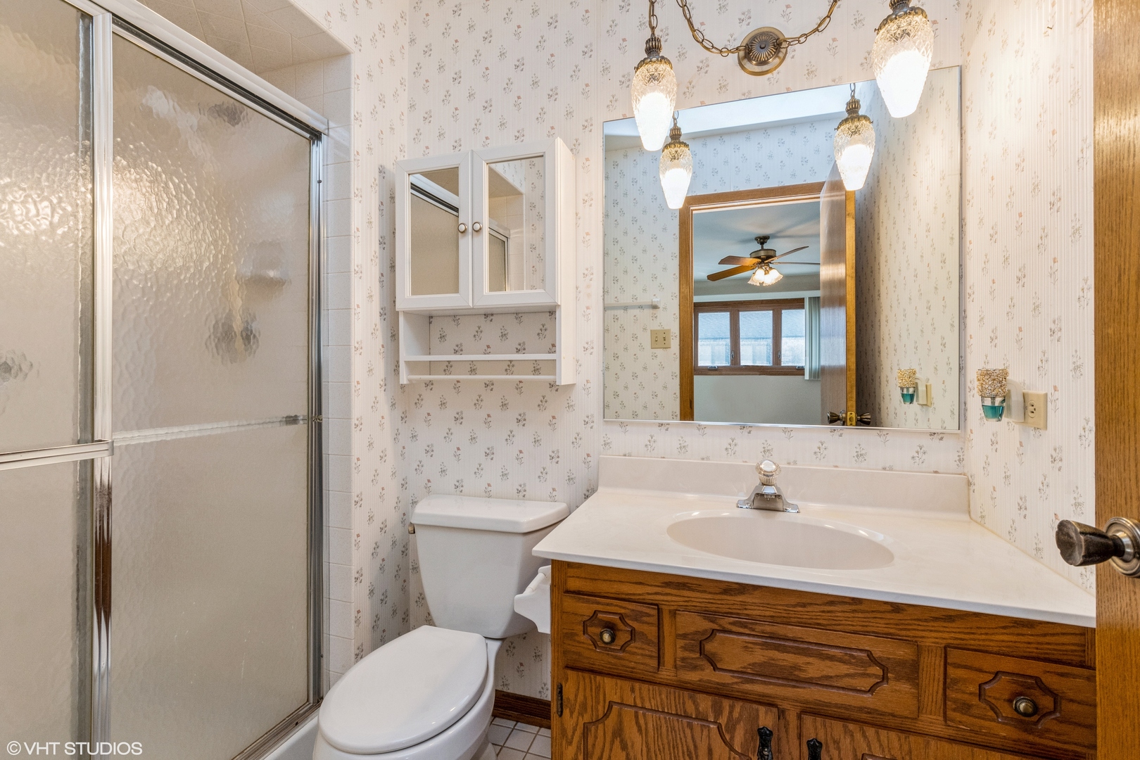 16142 Pine Drive Tinley Park, IL 60477 - Photo 8 of 12 a bathroom with a sink toilet and shower