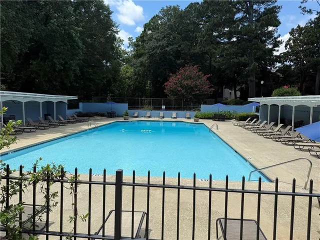 a view of a swimming pool with a patio