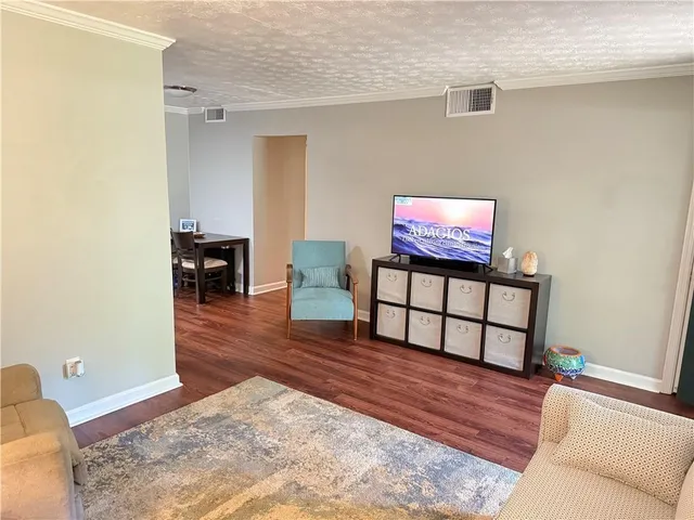 a view of a livingroom with furniture and wooden floor