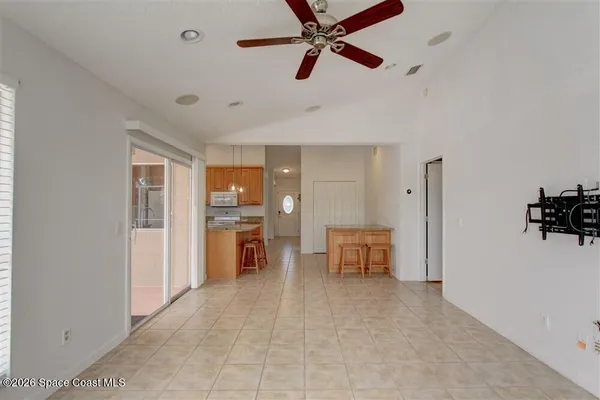 a view of a livingroom with kitchen and furniture