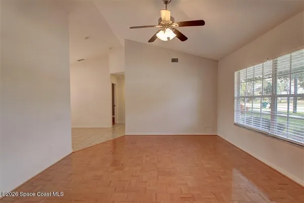 a view of an empty room with a window