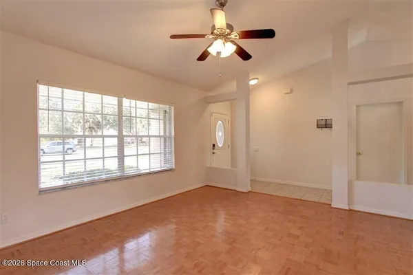 a view of an empty room with a window