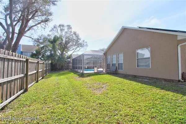 a view of a house with a yard and garage