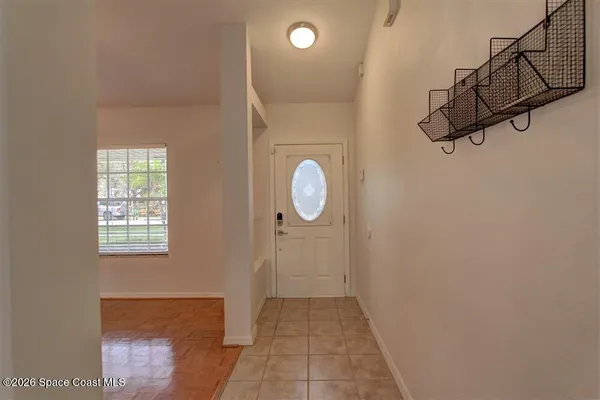 a view of a livingroom with wooden floor and window
