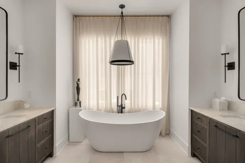 a bathroom with a glass shower door