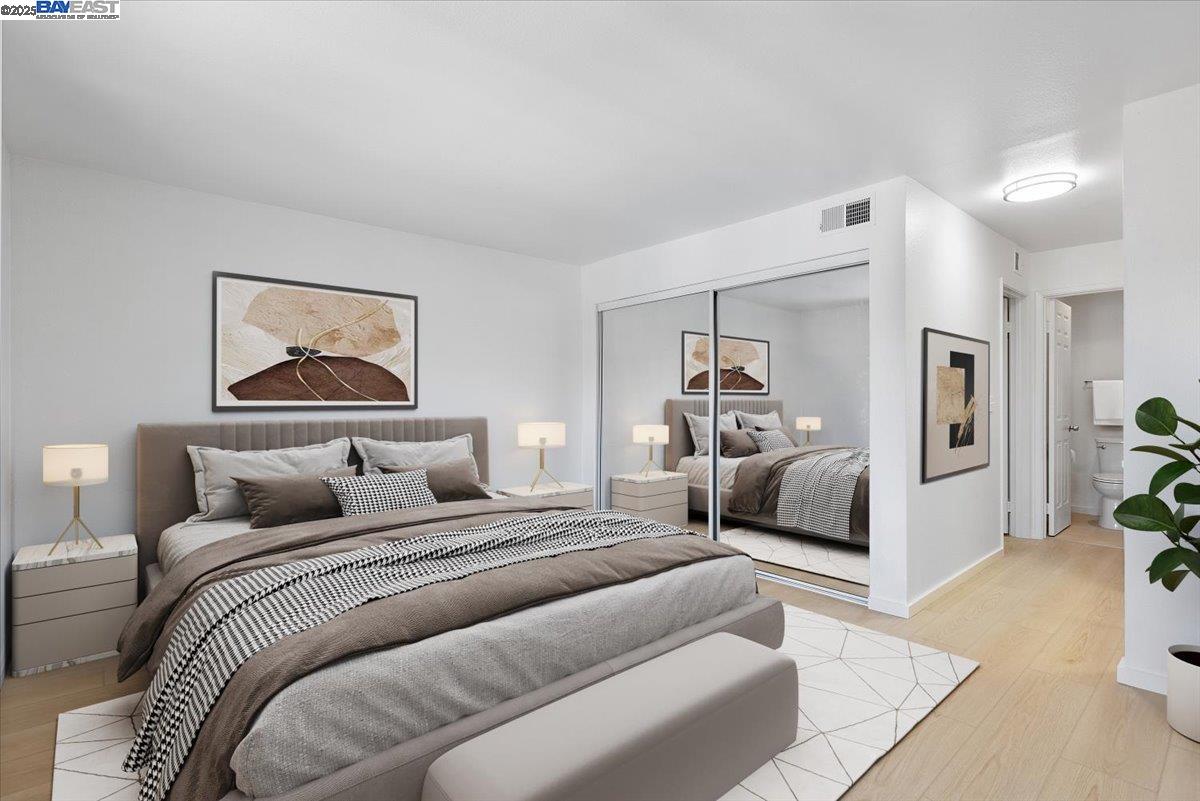 1318 B Street, Unit 314 Hayward, CA 94541 - Photo 14 of 20 a bedroom with a large bed and a couch