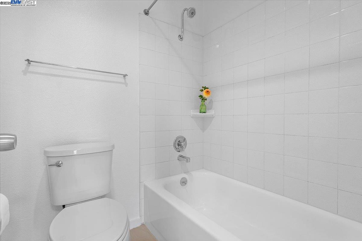 1318 B Street, Unit 314 Hayward, CA 94541 - Photo 17 of 20 a bathroom with a sink a toilet and tub