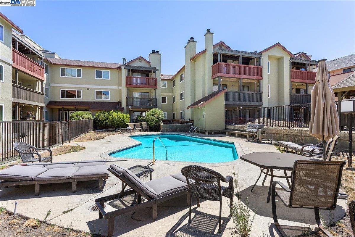 1318 B Street, Unit 314 Hayward, CA 94541 - Photo 20 of 20 a view of a patio with swimming pool