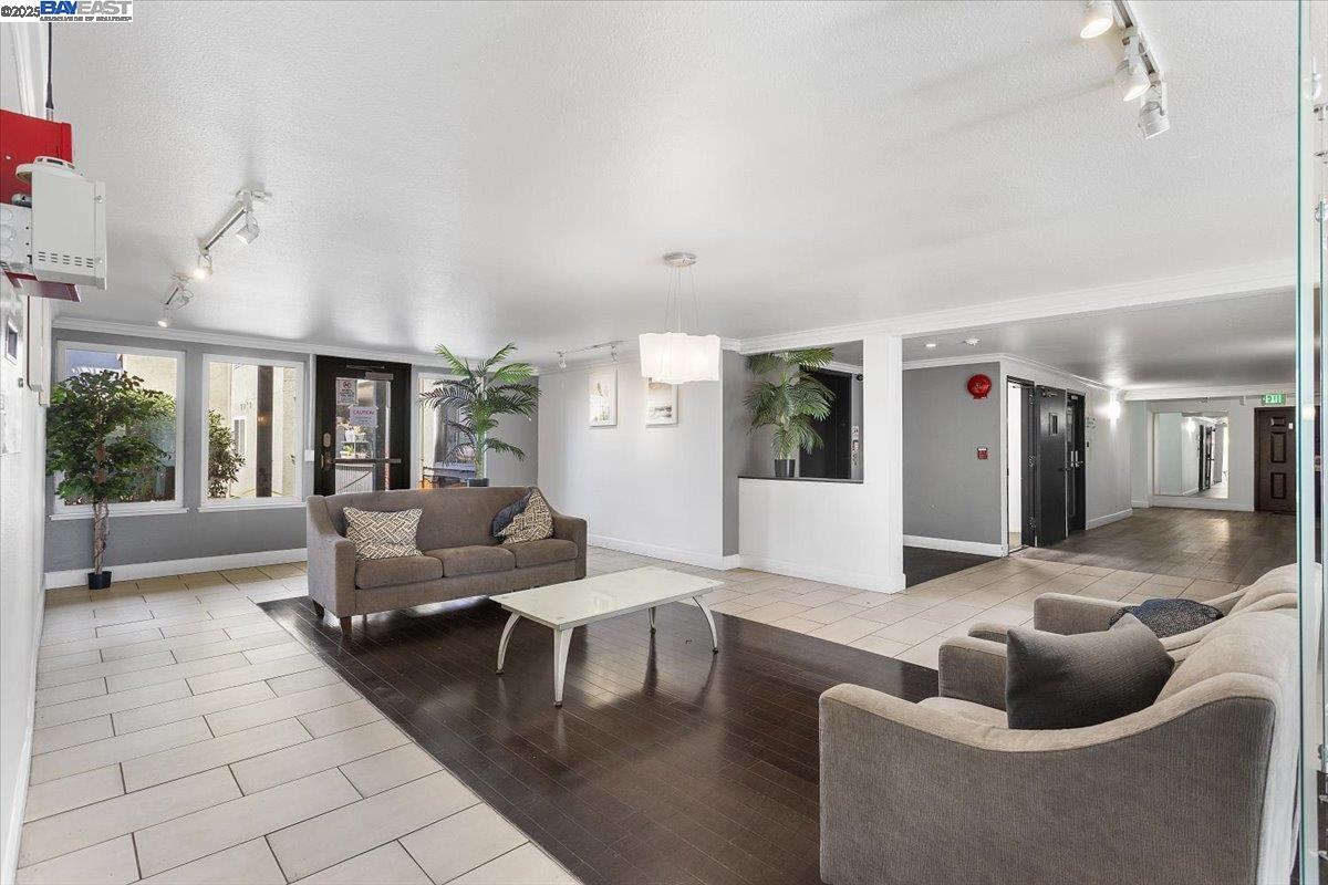 1318 B Street, Unit 314 Hayward, CA 94541 - Photo 5 of 20 a living room with furniture and a large window