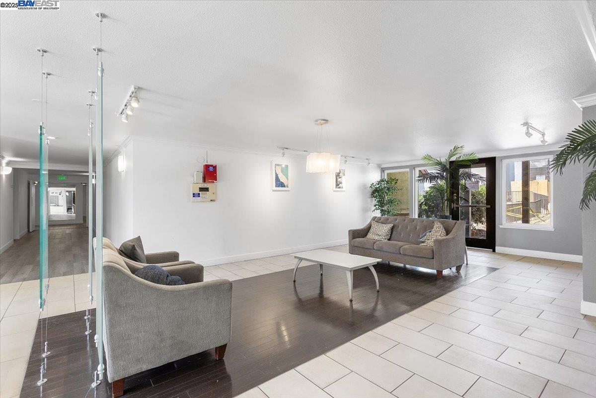 1318 B Street, Unit 314 Hayward, CA 94541 - Photo 6 of 20 a living room with furniture and a window