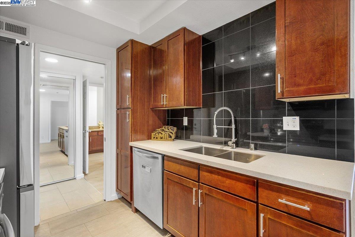 1318 B Street, Unit 314 Hayward, CA 94541 - Photo 9 of 20 a kitchen with a sink and cabinets