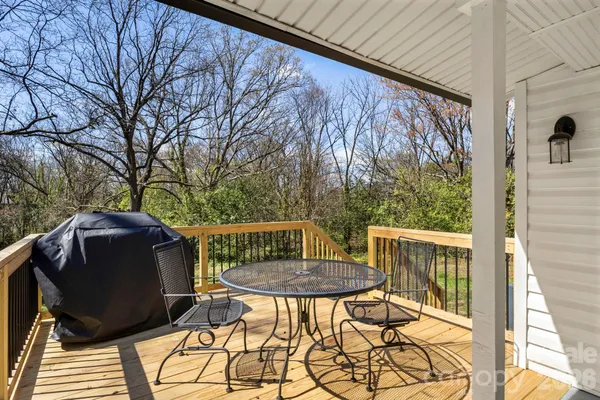 a view of a patio with a table and chairs