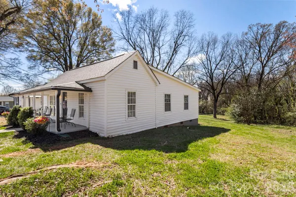 a view of a park with iron fence