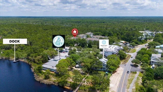 an aerial view of a houses with yard
