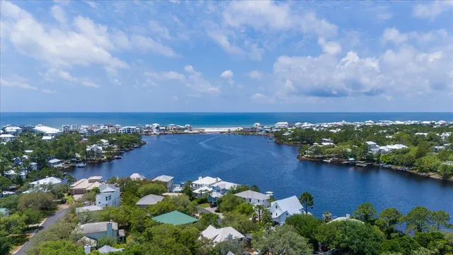 an aerial view of a houses with city view and lake view