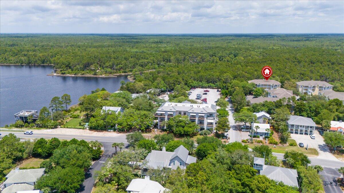 34 Heron's Watch Way, Unit 1203 Santa Rosa Beach, FL 32459 - Photo 3 of 16 a aerial view of a house with a yard and lake view