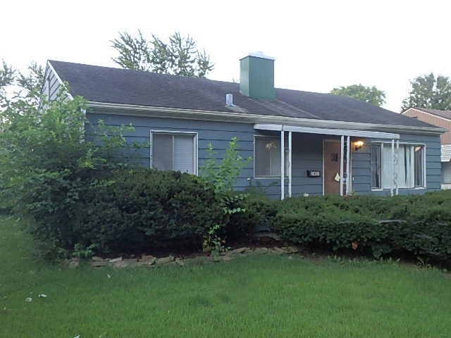 2407 Sunset Road Hazel Crest, IL 60429 - Photo 1 of 7 a front view of a house with a garden