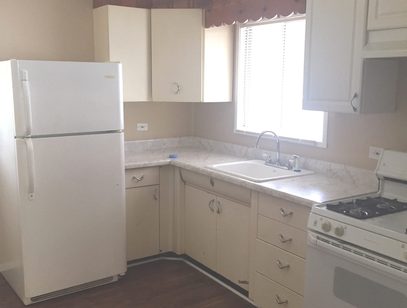 2407 Sunset Road Hazel Crest, IL 60429 - Photo 2 of 7 a white refrigerator freezer sitting inside of a kitchen