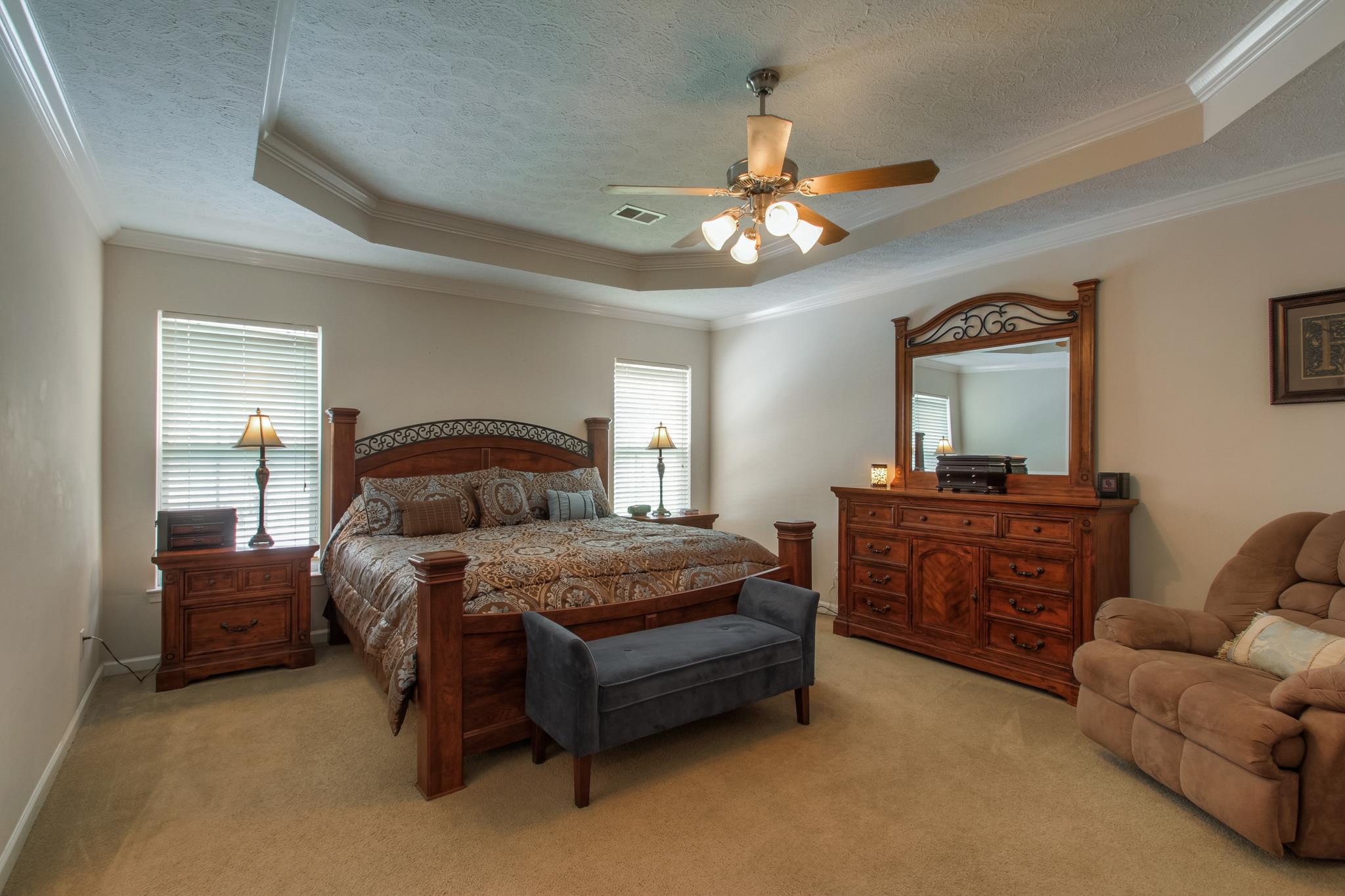 2004 Greg Court Spring Hill, TN 37174 - Photo 8 of 17 a bedroom with a bed and a couch