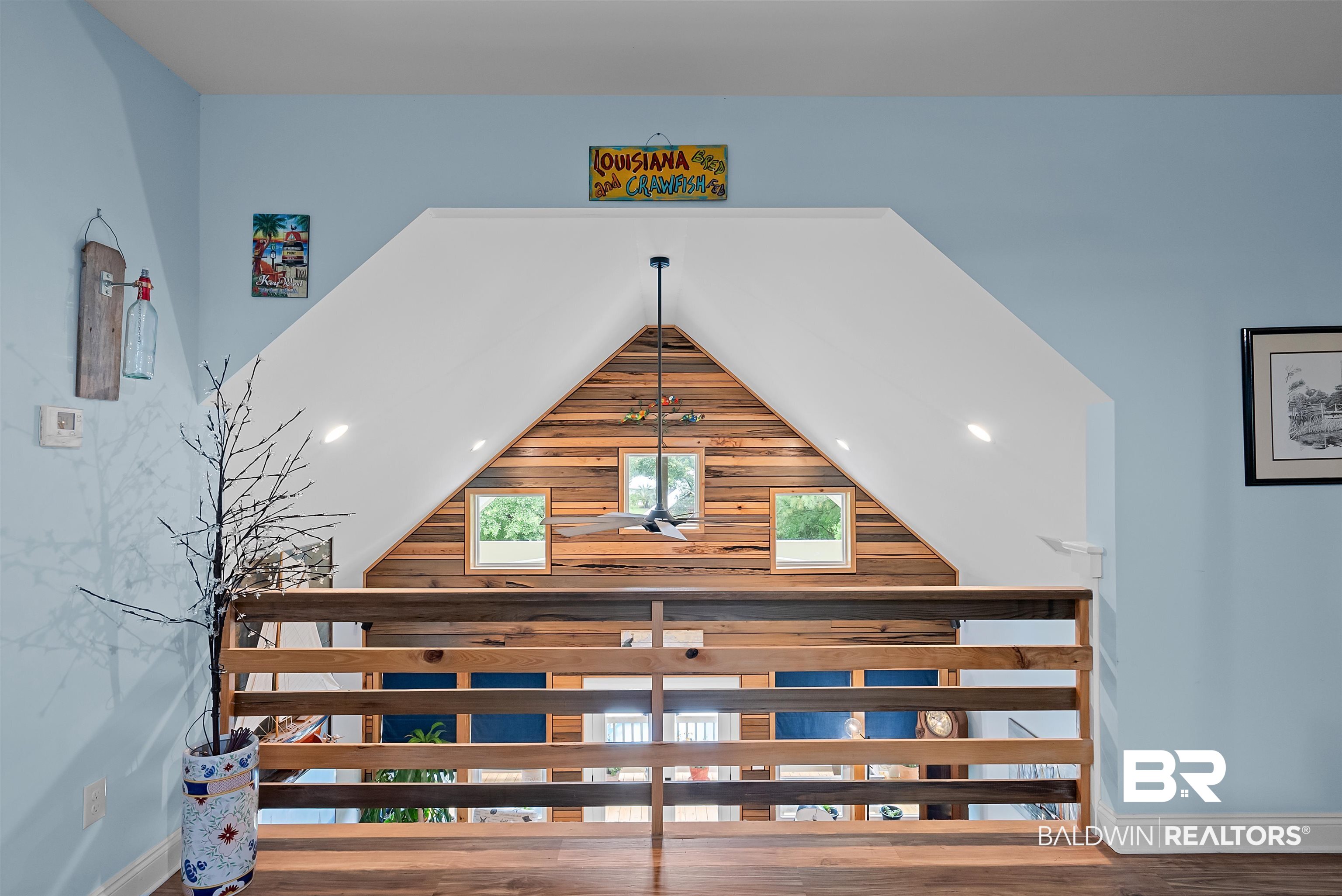 7266 Franklin Road Foley, AL 36535 - Photo 42 of 64 Upper-level landing featuring a wood-finish floor and a horizontal plank railing