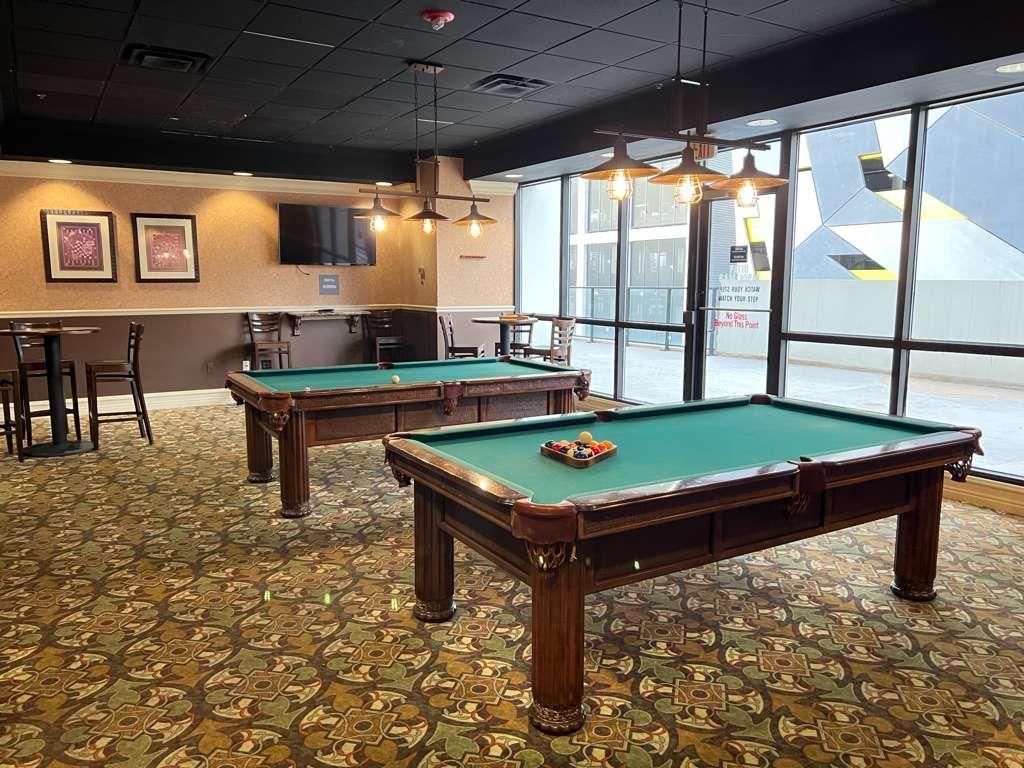 1280 West Peachtree Street Northwest, Unit 1113 Atlanta, GA 30309 - Photo 11 of 16 a room with pool table a flat screen tv and windows