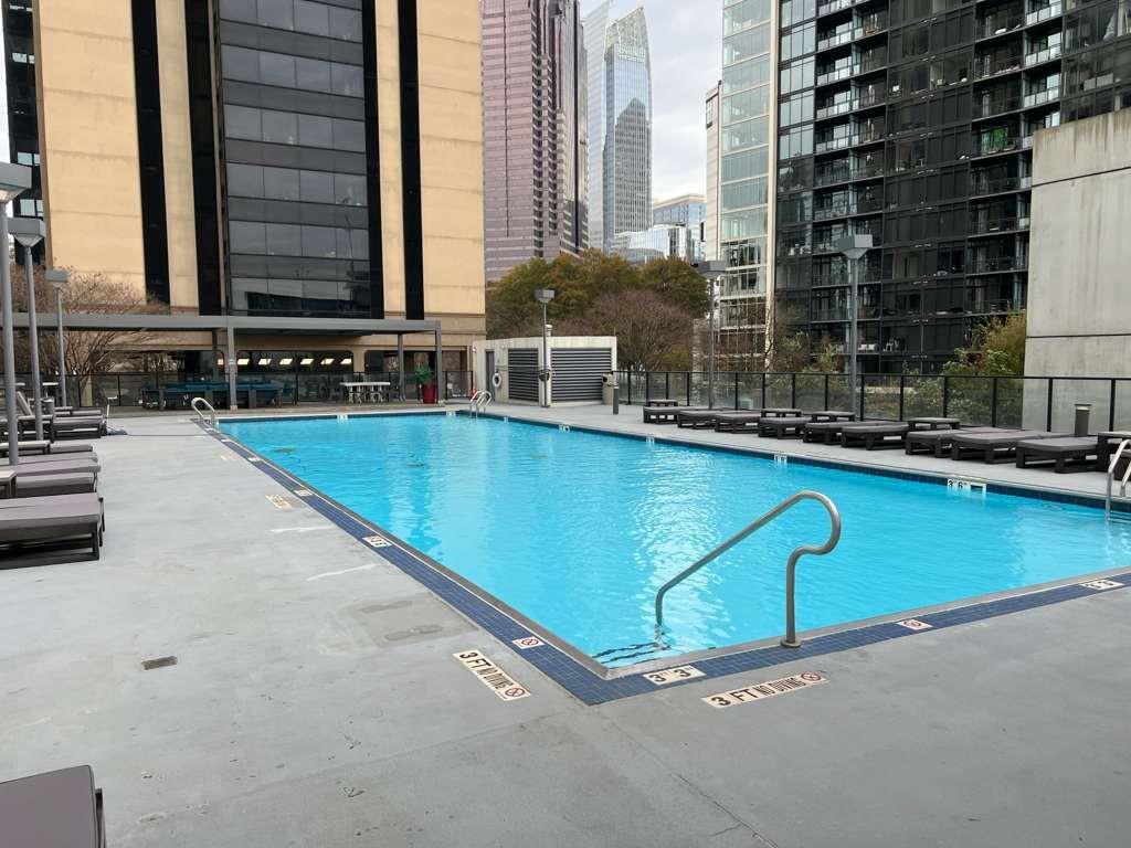 1280 West Peachtree Street Northwest, Unit 1113 Atlanta, GA 30309 - Photo 12 of 16 a view of pool with outdoor seating