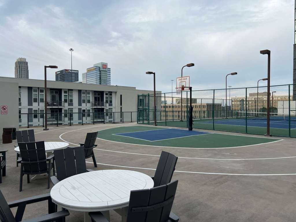 1280 West Peachtree Street Northwest, Unit 1113 Atlanta, GA 30309 - Photo 14 of 16 a view of a balcony with table and chairs