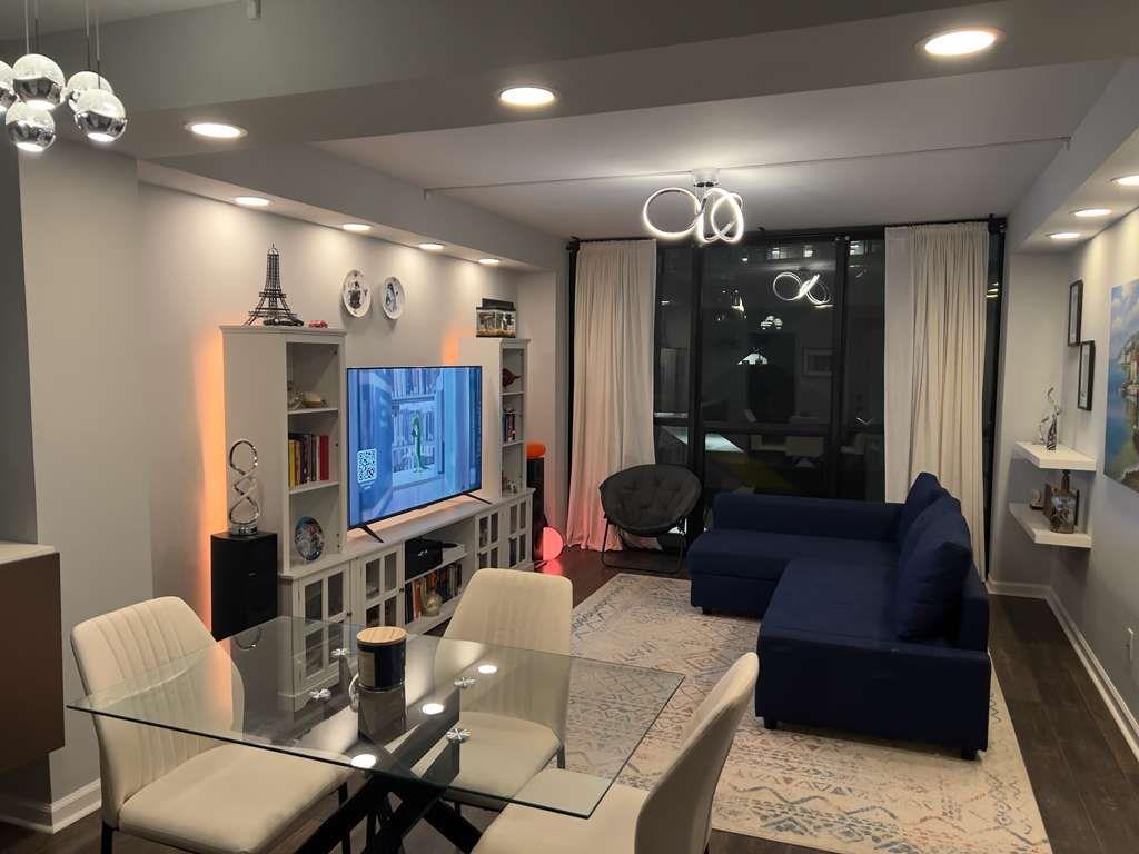 1280 West Peachtree Street Northwest, Unit 1113 Atlanta, GA 30309 - Photo 5 of 16 a living room with furniture and wooden floor