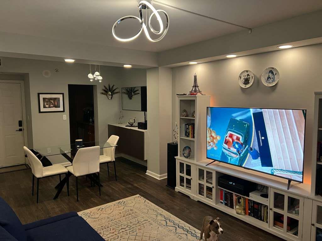 1280 West Peachtree Street Northwest, Unit 1113 Atlanta, GA 30309 - Photo 6 of 16 a living room with furniture and a flat screen tv