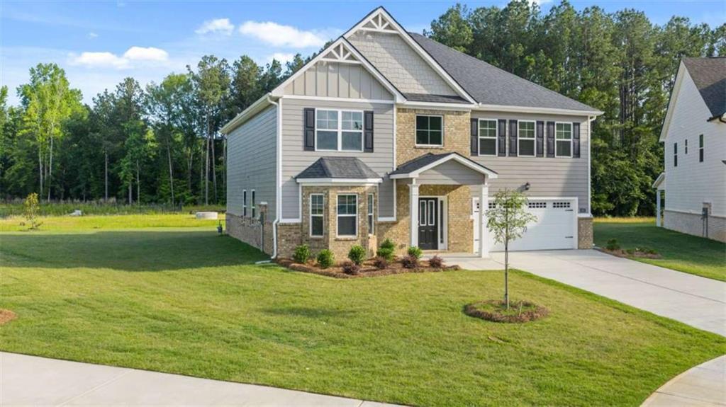 13593 Whitman Lane Covington, GA 30014 - Photo 3 of 25 a front view of a house with a yard