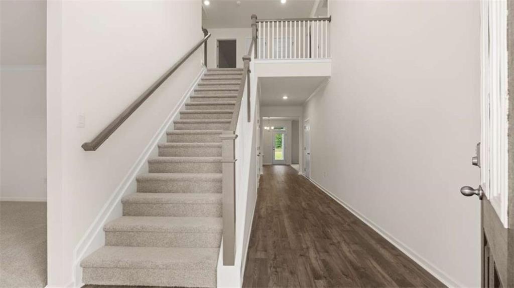 13593 Whitman Lane Covington, GA 30014 - Photo 5 of 25 a view of entryway and hall with wooden floor