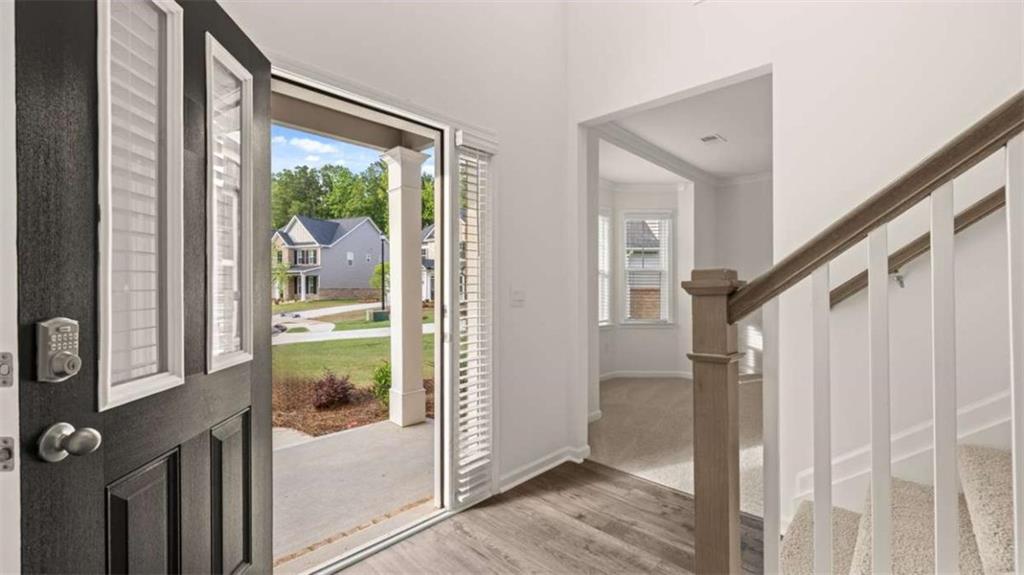 13593 Whitman Lane Covington, GA 30014 - Photo 6 of 25 a view of entryway with wooden floor and door