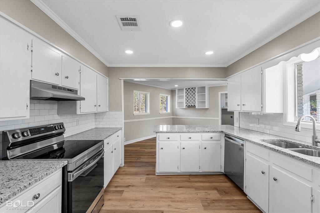 119 Stateny Lane Grand Cane, LA 71032 - Photo 11 of 40 a kitchen with granite countertop a sink and cabinets