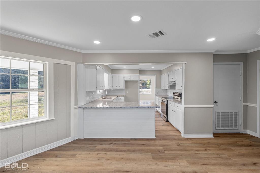 119 Stateny Lane Grand Cane, LA 71032 - Photo 15 of 40 a view of kitchen with cabinets and wooden floor