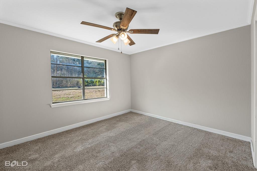 119 Stateny Lane Grand Cane, LA 71032 - Photo 26 of 40 an empty room with windows and fan