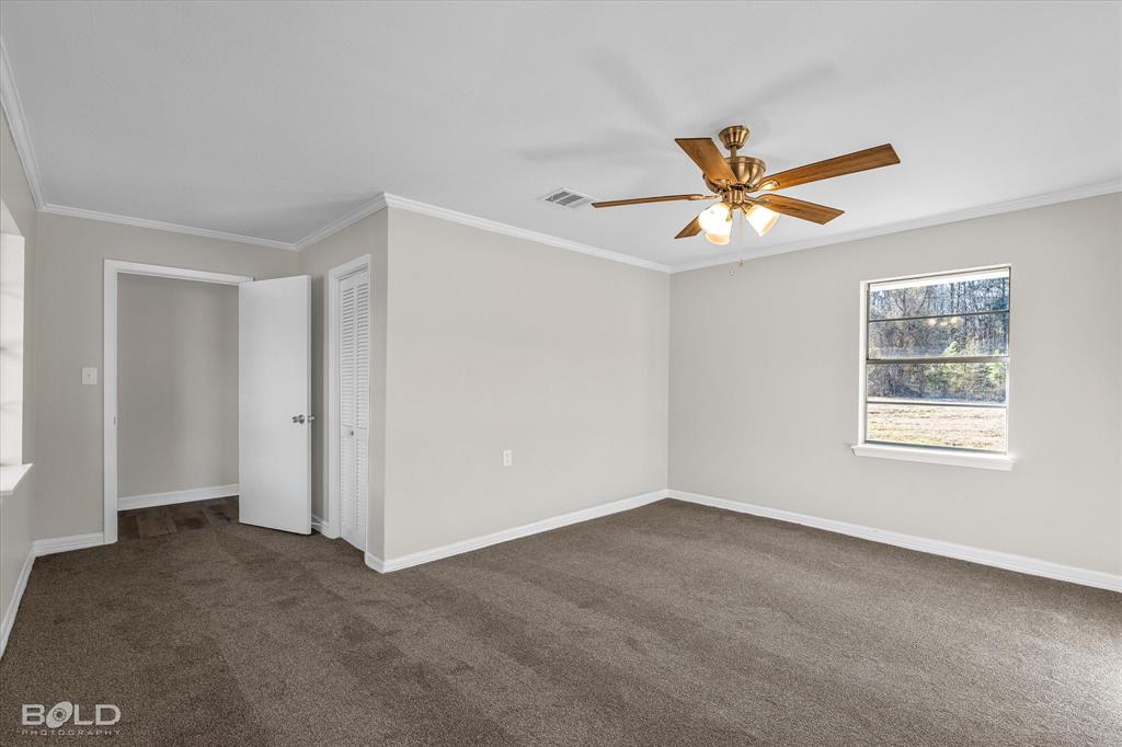 119 Stateny Lane Grand Cane, LA 71032 - Photo 28 of 40 a view of a livingroom with a ceiling fan and window