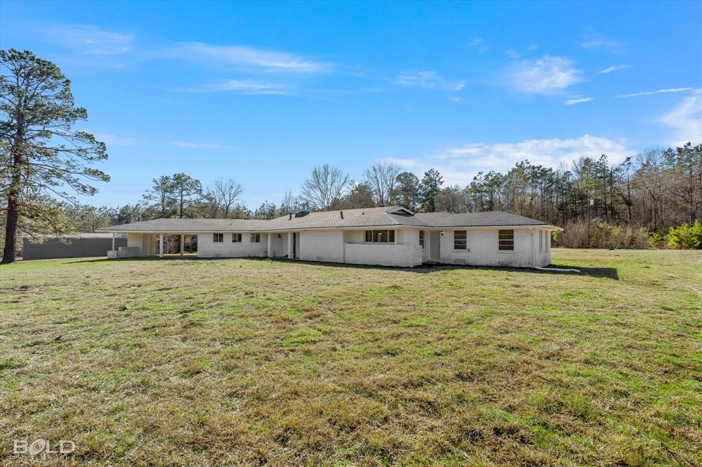 119 Stateny Lane Grand Cane, LA 71032 - Photo 32 of 40 a large building with a big yard