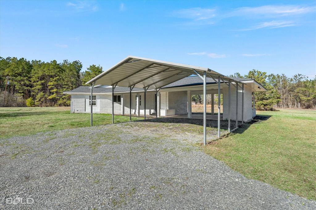 119 Stateny Lane Grand Cane, LA 71032 - Photo 33 of 40 a view of a house with backyard and trees