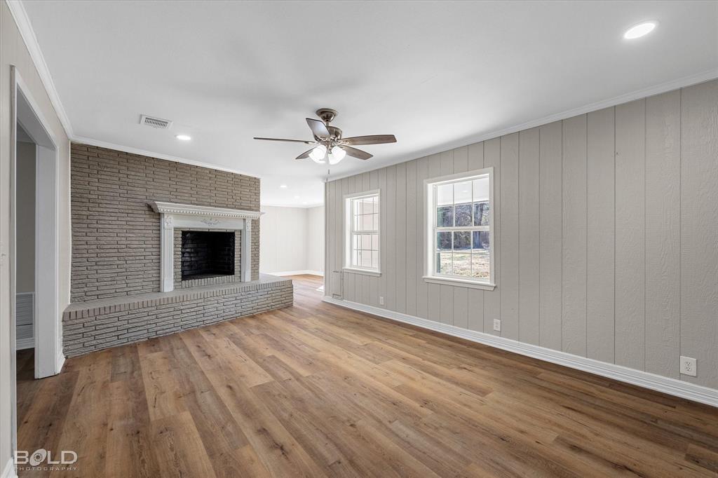 119 Stateny Lane Grand Cane, LA 71032 - Photo 4 of 40 a view of an empty room with wooden floor and a window