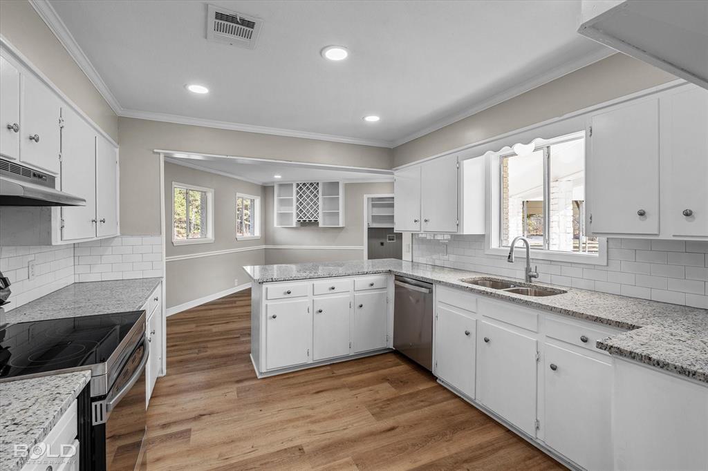 119 Stateny Lane Grand Cane, LA 71032 - Photo 10 of 40 a kitchen with granite countertop a sink and cabinets