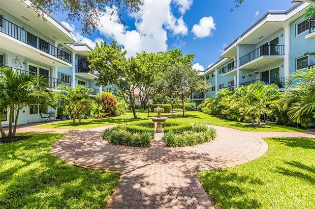 a view of a building with a yard