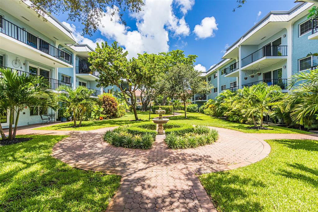 3000 Northeast 5th Terrace, Unit 110A Wilton Manors, FL 33334 - Photo 2 of 30 a view of a building with a yard