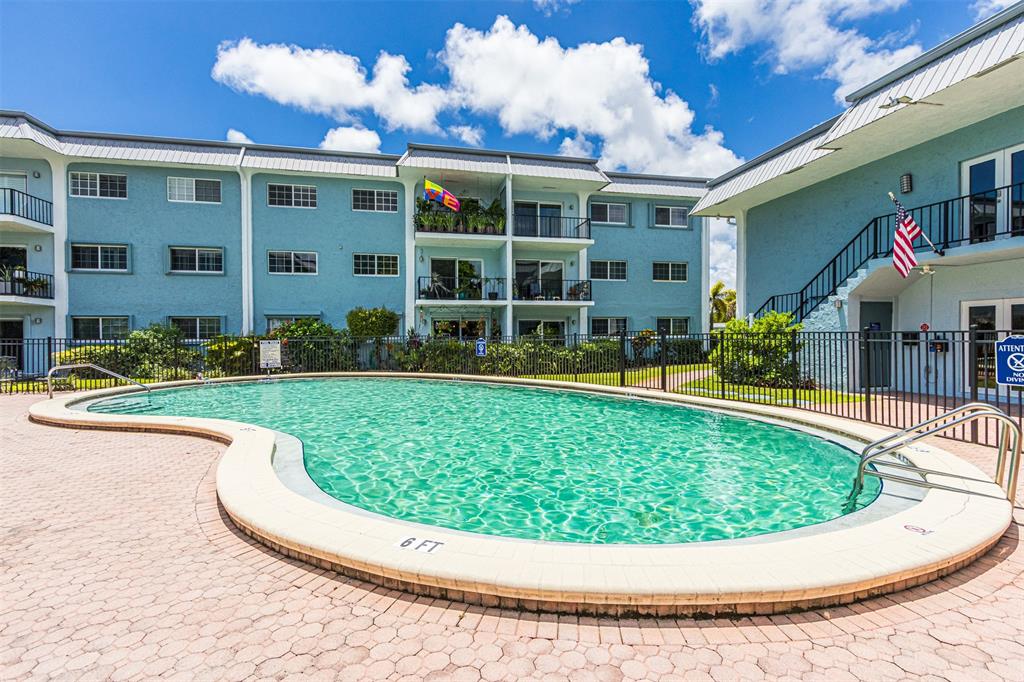 3000 Northeast 5th Terrace, Unit 110A Wilton Manors, FL 33334 - Photo 28 of 30 a view of swimming pool with a garden