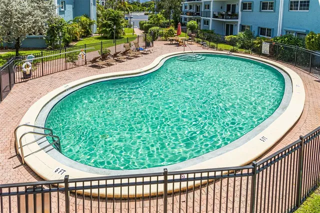 a view of swimming pool from a balcony