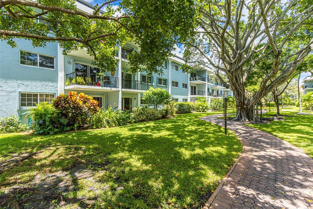 3000 Northeast 5th Terrace, Unit 110A Wilton Manors, FL 33334 - Photo 3 of 30 a view of a house with a garden