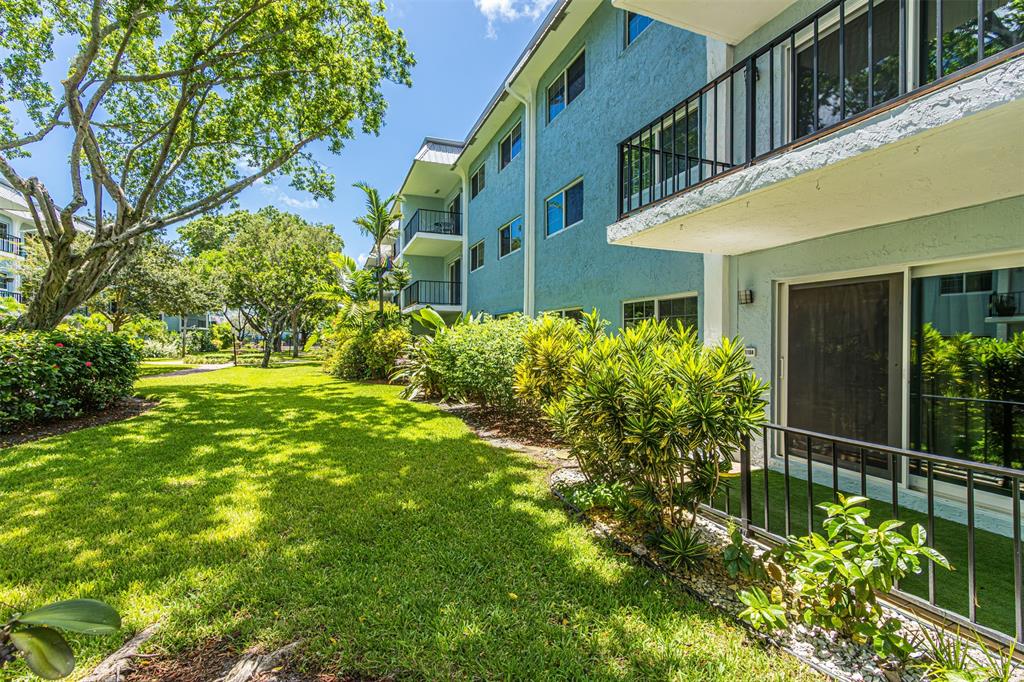 3000 Northeast 5th Terrace, Unit 110A Wilton Manors, FL 33334 - Photo 4 of 30 a view of an house with backyard and garden