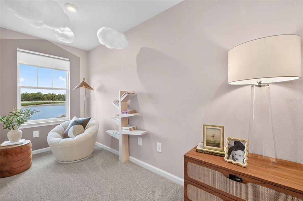 8846 Ginko Run Parrish, FL 34219 - Photo 16 of 24 a living room with furniture and a potted plant
