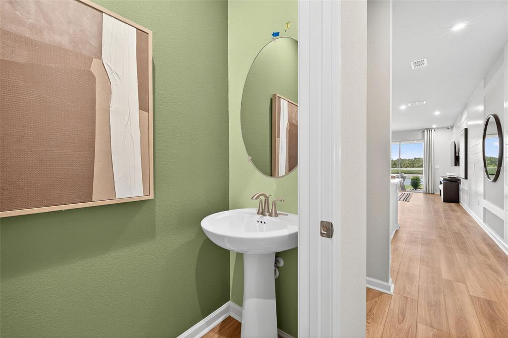 8846 Ginko Run Parrish, FL 34219 - Photo 10 of 24 a bathroom with a sink and a mirror