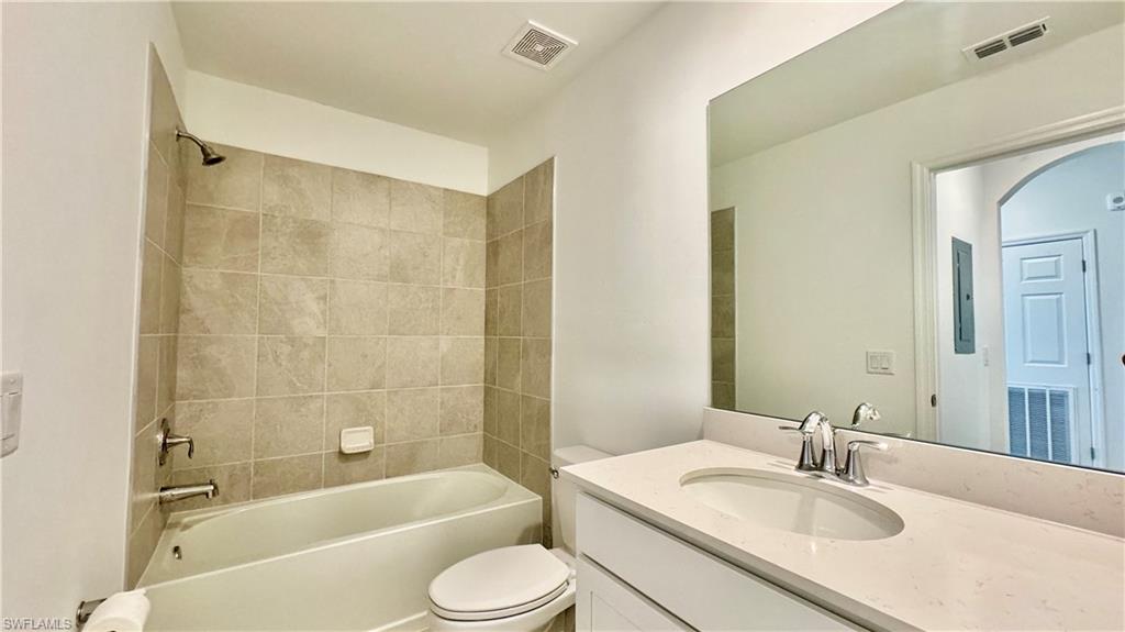 43993 Boardwalk Loop, Unit 1932 Punta Gorda, FL 33982 - Photo 14 of 17 a bathroom with a sink toilet and shower