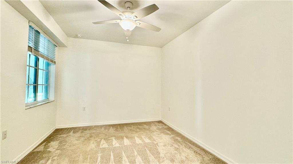 43993 Boardwalk Loop, Unit 1932 Punta Gorda, FL 33982 - Photo 9 of 17 an empty room with a window and a fan